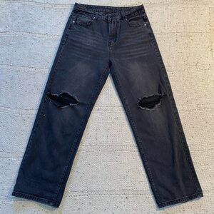 Black ripped jeans with a super loose flowy wide leg